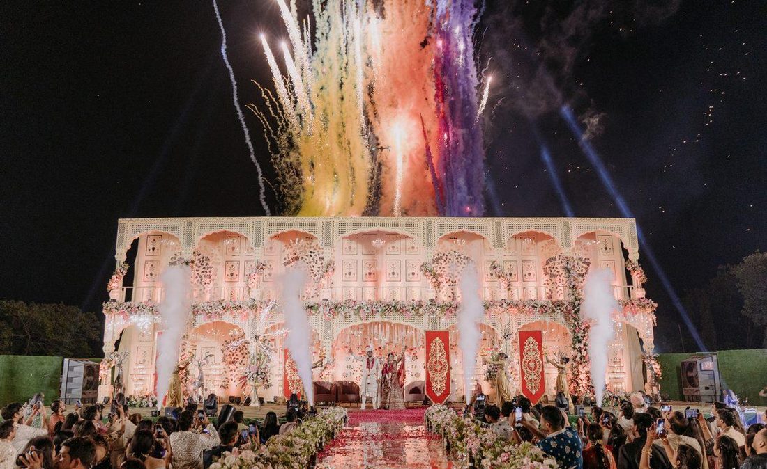 Fireworks moment, bride and groom on stage