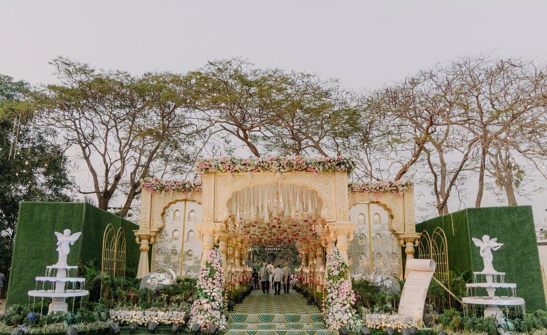 Guest entry pathway with arches and trees