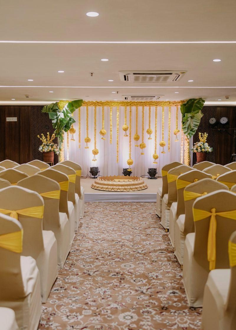 Haldi setup with yellow garlands and banana leaves